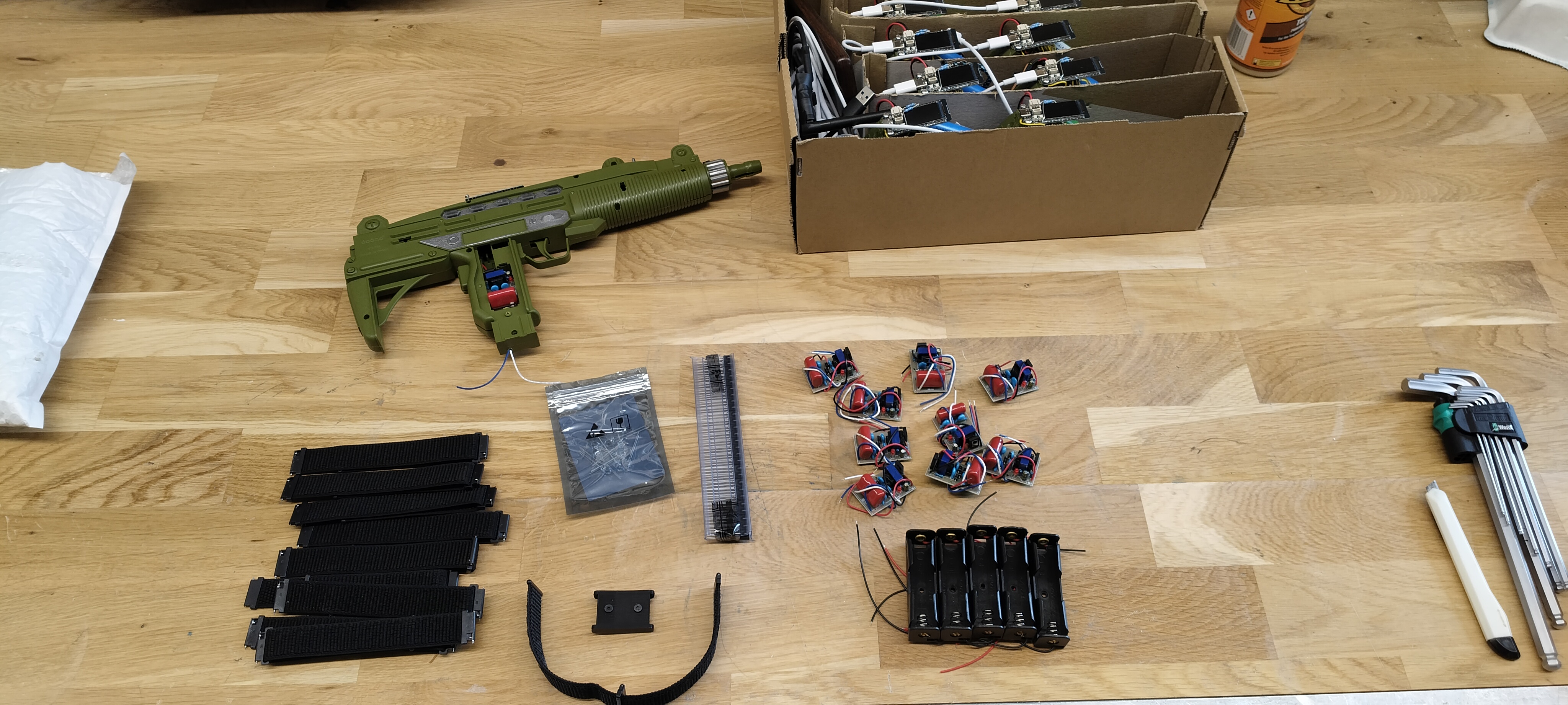 Taser game V2 components with V1 box in background
